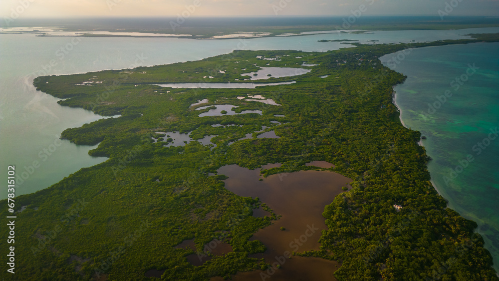 drone fly above natural park biosphere reserve in Tulum Sian Ka'an aerial high angle of punta Allen lighthouse