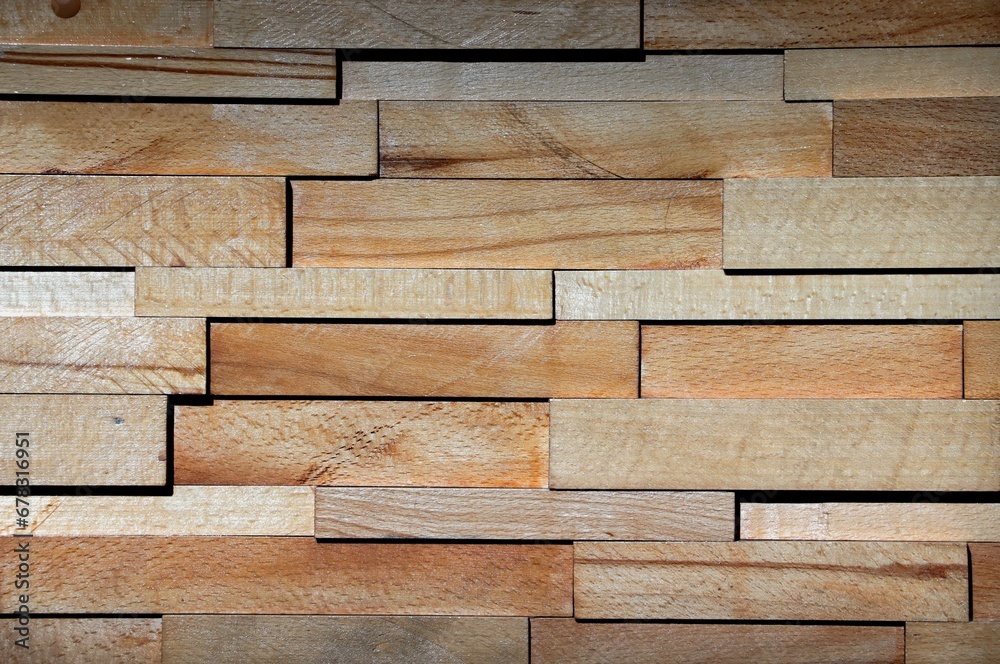 Background, texture wall decorated with wooden boards of various sizes Background, texture wall decorated with wooden boards of various sizes