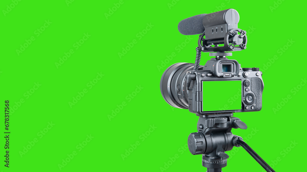 Photo, video camera with microphone. Digital or Dslr camera on tripod. Green screen or Chroma key. Photographer or videographer studio for recording film project. Blogger, television equipment