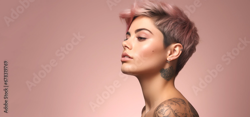 Portrait of young happy woman with short funky hairstyle and tattoo. Skin care beauty, skincare cosmetics, isolated over light pink background. photo