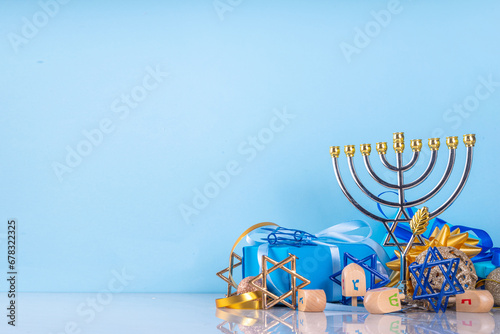 Happy Hanukkah greeting card background. Jewish New Year holiday flat lay with traditional symbols of hanukkah festival, menorah, donuts and decorations copy space