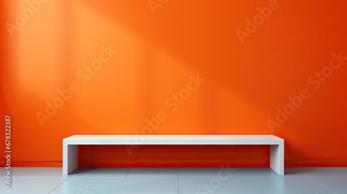 Sleek white bench against a vibrant orange wall in a minimalist setting photo