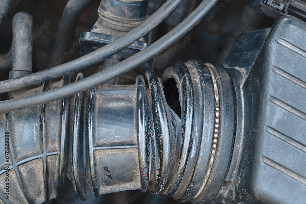 Air Intake cracks and leaks. Air intake hose problems. Damaged rubber tube, hole and cracks in