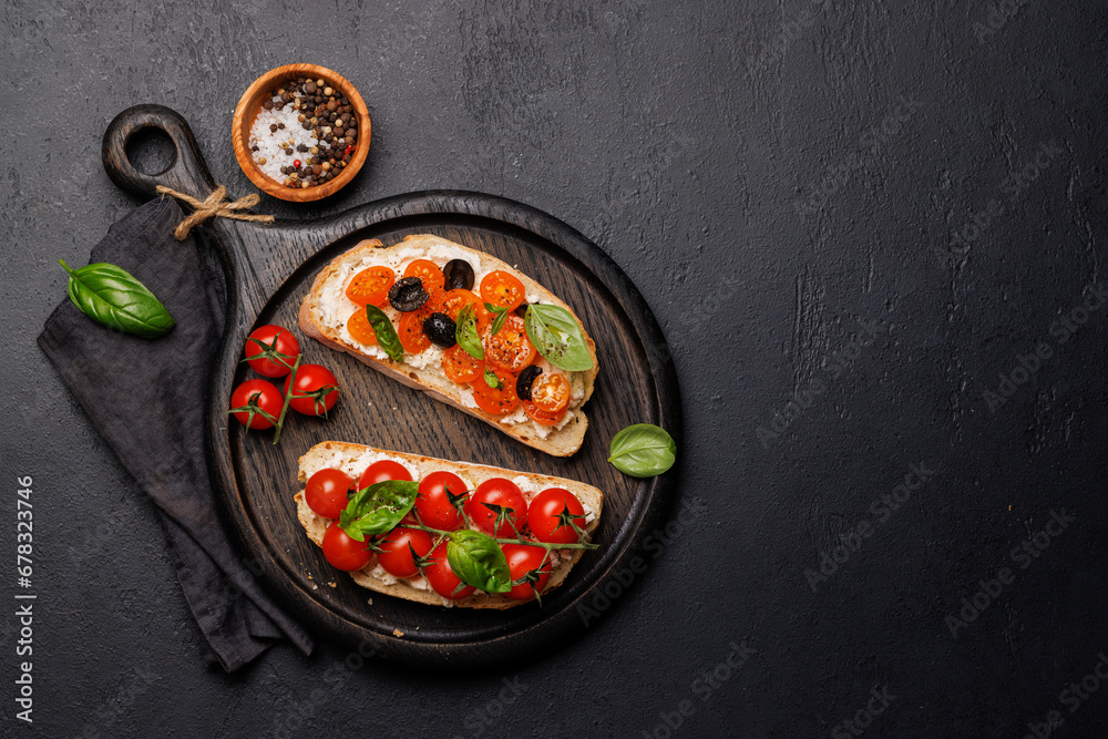 Sandwich set of bruschetta with juicy tomatoes, cheese and prosciutto Sandwich set of bruschetta with juicy tomatoes, cheese and prosciutto