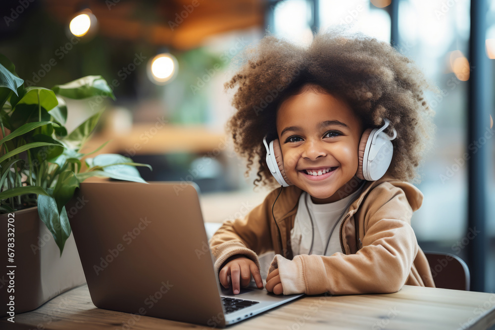Little African American boy learns to code at home online. Programming and coding training, distance learning, home learning Little African American boy learns to code at home online. Programming and coding training, distance learning, home learning