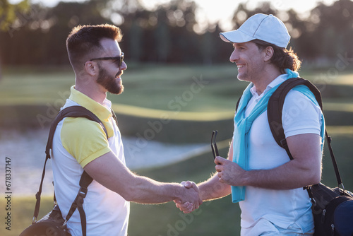 Men playing golf © georgerudy