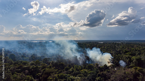Mysterious smoke over green canopy French Guiana forest