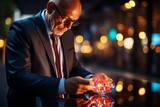 Businessman in a business suit holds in his hands a glowing futuristic object. Concept: business digitalization 