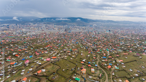 Vibrant yurts contrast urban Ulaanbaatar skyline