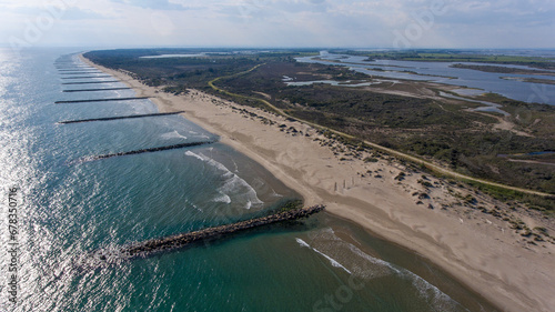 Coastal beauty of Espiguette with protective groynes.