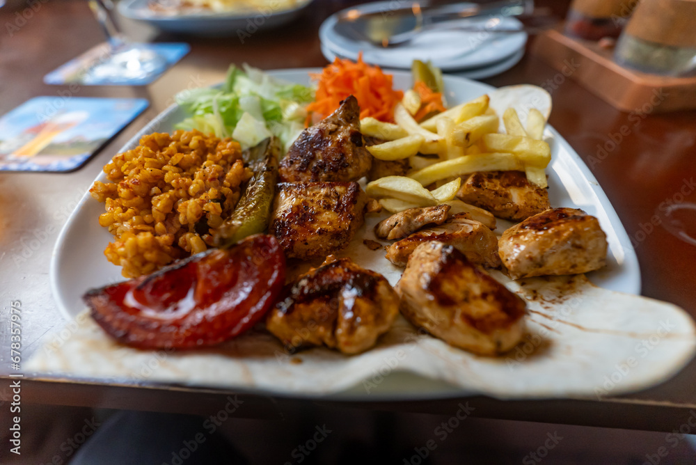 Grilled chicken breast in various variations with cherry tomatoes, green French beans, garlic, herbs Grilled chicken breast in various variations with cherry tomatoes, green French beans, garlic, herbs