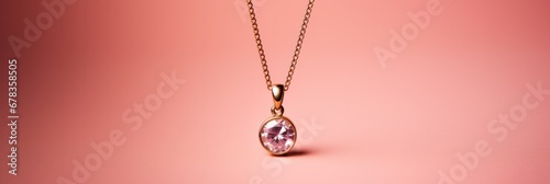 A delicate minimalist golden pendant necklace isolated on a pink gradient background 