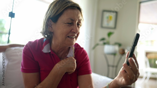 Elderly Woman Video Chatting with Family from Home  Grandma Connecting with Loved Ones via Smartphone Video Call