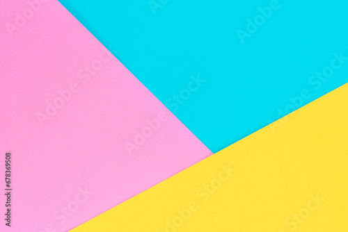 Yellow, pink and purple colored paper. Geometric empty paper background of three tones for copy space