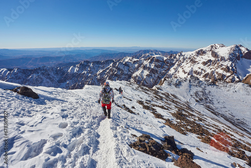 Hiking to the summit of Jebel Toubkal, mountain of Morocco. photo