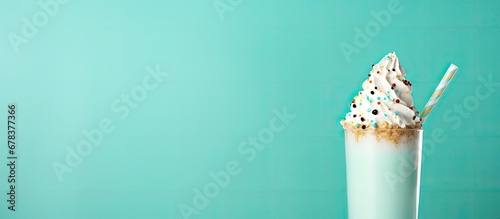 Teal background with milkshake and rim sprinkles photo