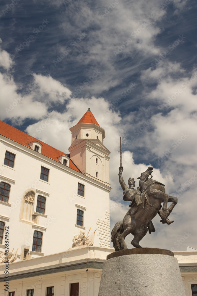 Statue of King Svatopluk and Bratislava castle in the background, Bratislava, Slovakia