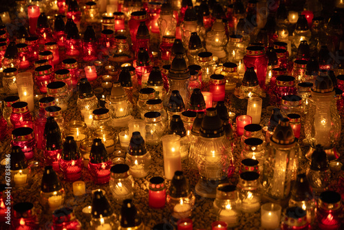 colour candles at cemetery night 