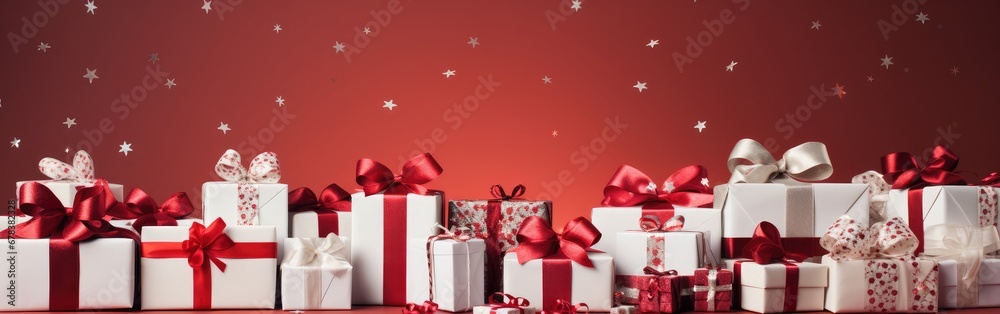 White gift boxes with red ribbon