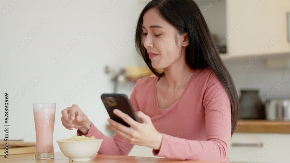 asian woman using mobile phone at home Communication and coziness concept.. asian woman using mobile phone at home Communication and coziness concept..