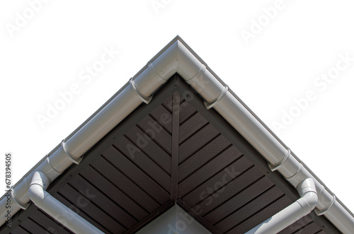 Bottom view of the corner of the house roof with rain gutter isolated photo