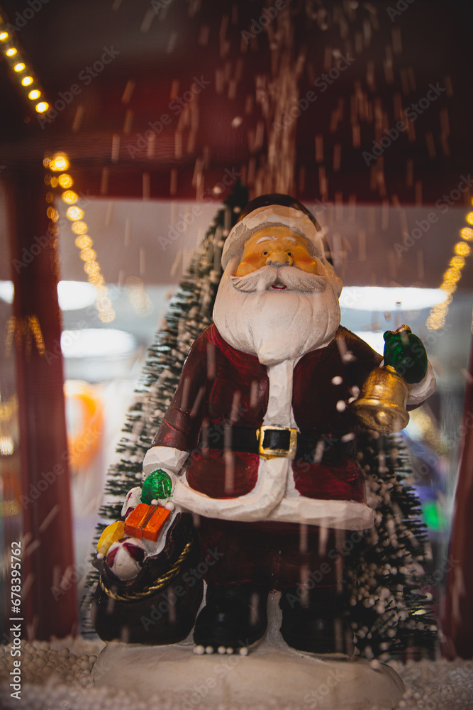 christmas decoration with santa claus and falling snow