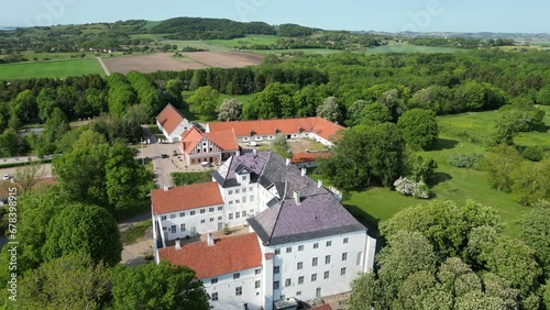 Dragsholm Castle Denmark with surrounding farms, nature and sea on a sunny day photo