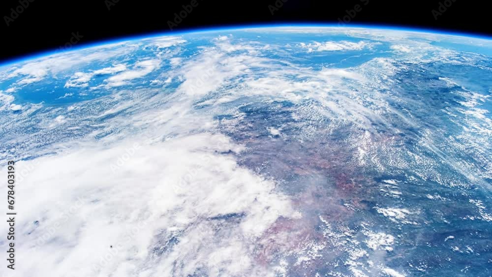 Beautiful clouds and atmosphere of Planet Earth from above. Flying over planet Earth. View from International Space Station. Public Domain images from Nasa	
