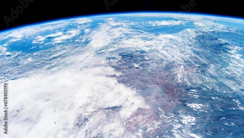 Beautiful clouds and atmosphere of Planet Earth from above. Flying over planet Earth. View from International Space Station. Public Domain images from Nasa	