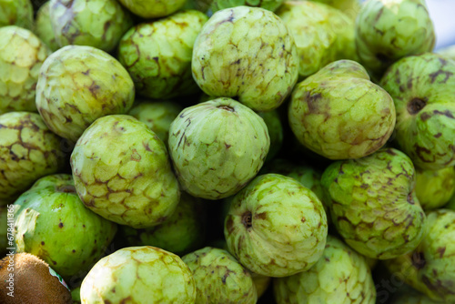 Cherimoya or custard apples displayed for sale at farmers market