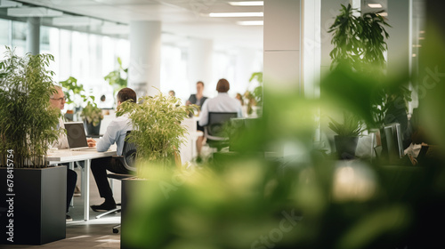 Business office in germany with blurred people casual wear, with blurred bokeh background. good atmosphere, many green plants,