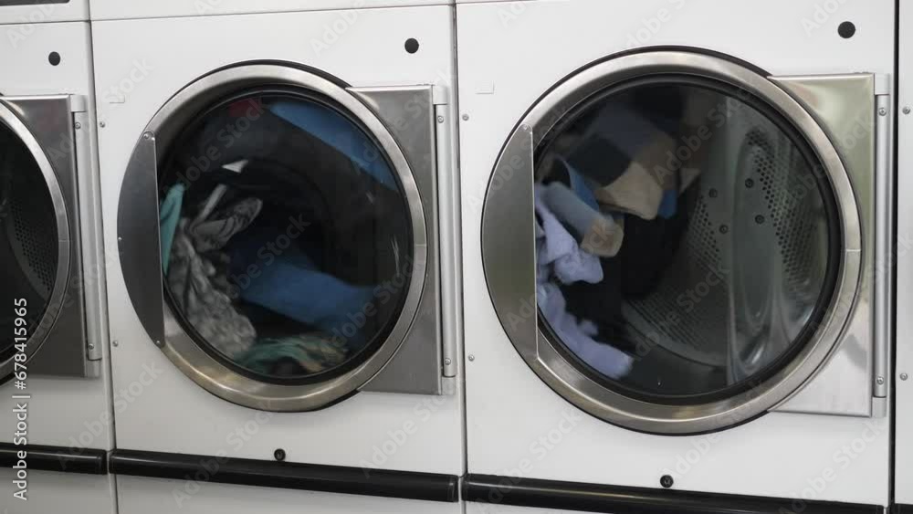 Close-up of a washing machine with things while working. The concept of washing and cleaning in the house