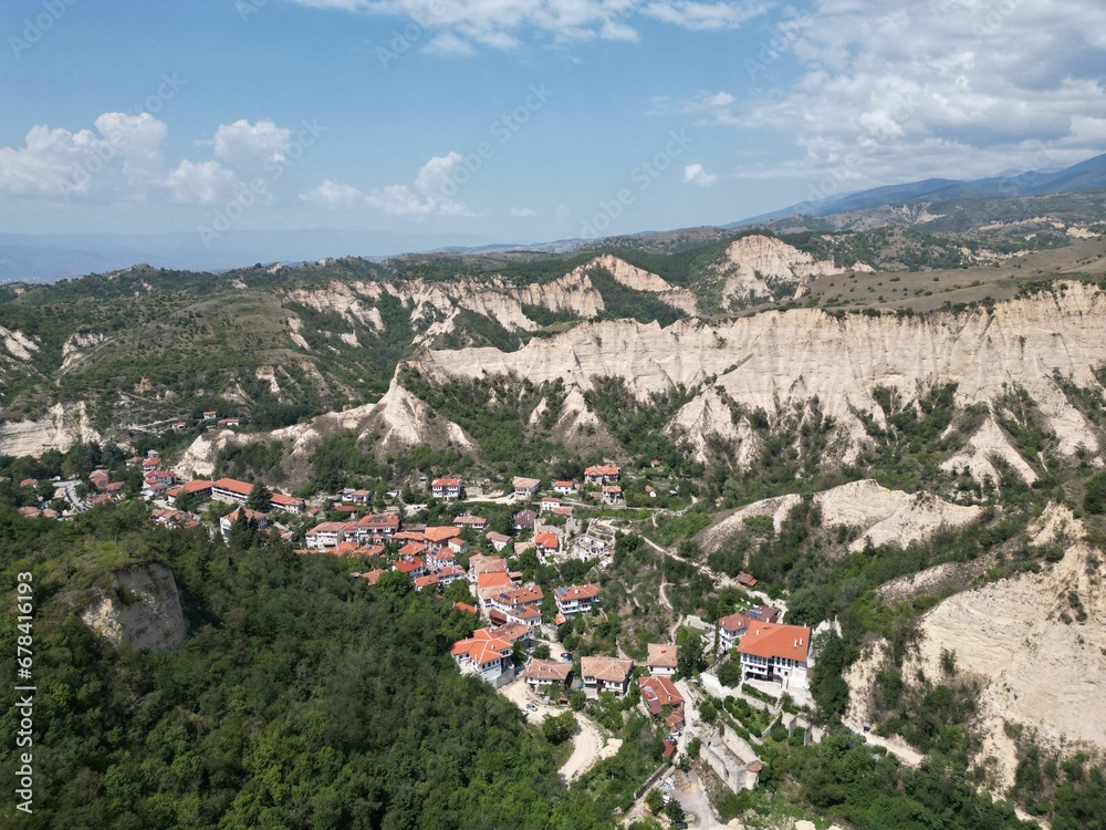 Aerial shot over the town of Melnik and rocky heights around on a summer day, Bulgaria
