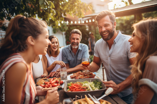 Happy family celebrating at summer party outdoor. Group of people with different ages and ethnicity having fun together outside. Friendship and celebration concept, people for barbecue