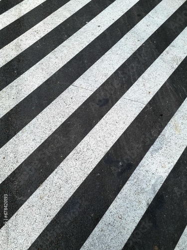 Closeup shot of a street white lines.