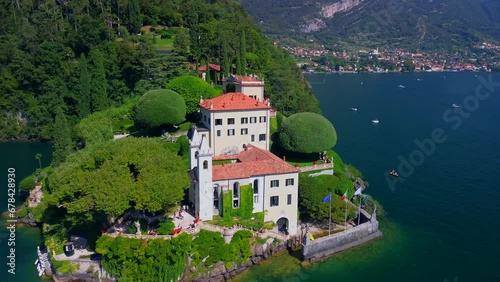 Aerial view of the luxury Villa Balbianello with terraced gardens, on the rocky wooded peninsula of Lavedo on Lake Como, panorama, picturesque residence. Green Planet. Nature. Lenno Italy 10.2023