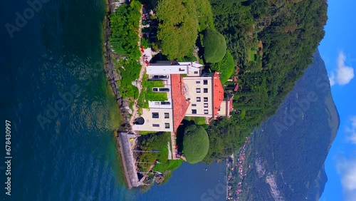 Aerial view of the luxury resort Villa Balbianello with terraced gardens, on the rocky wooded peninsula of Lavedo on Lake Como, panorama, picturesque residence. Green Planet. Nature. Lenno Italy  photo