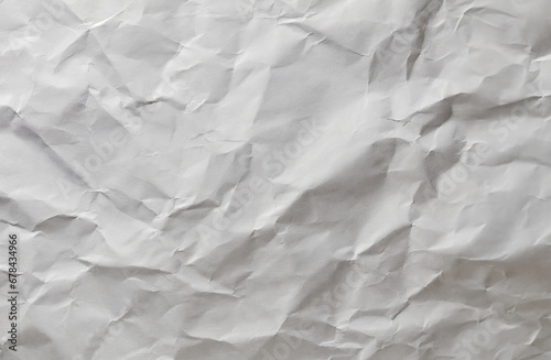 Crumpled white paper, uneven surface of the gray paper.