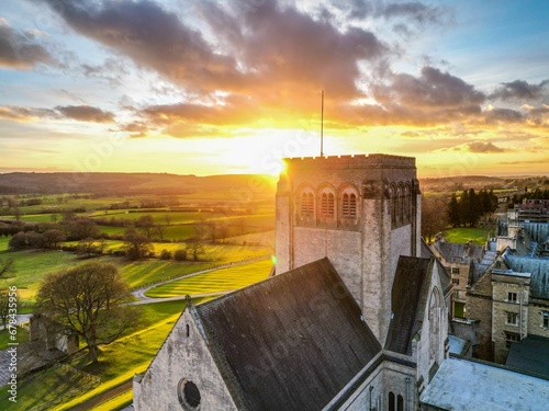 Drone shot of the roofs of big houses and the Ampleforth Abbey in a UK at sunset