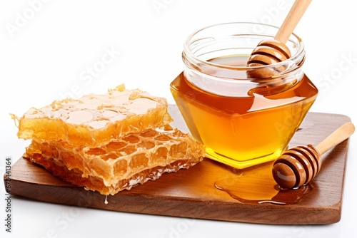 Golden honey and honeycomb isolated on white background for culinary and health concepts