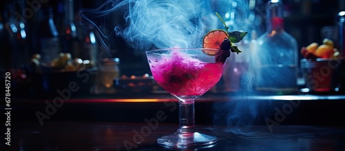 A delicious cocktail with liquid nitrogen is served on the bar photo