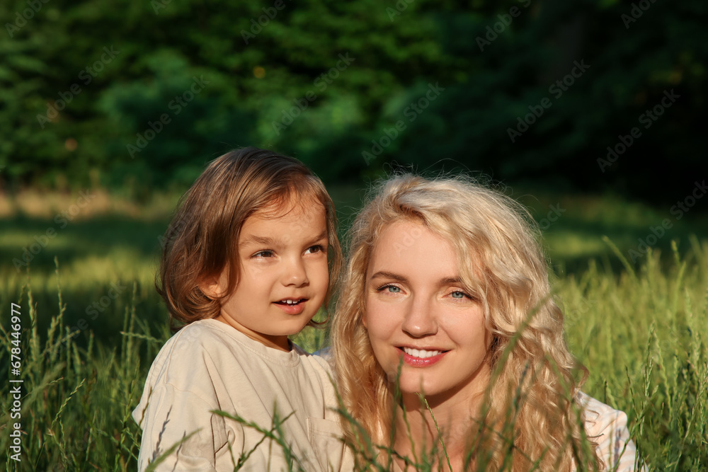 Happy mother with her cute daughter spending time together outdoors Happy mother with her cute daughter spending time together outdoors