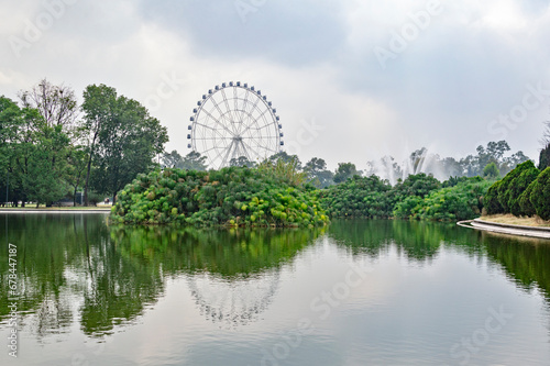 lake in chapultepec park and roller coaster in mexico city 