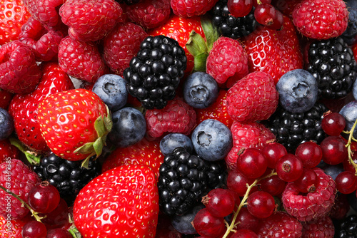 Fototapeta Naklejka Na Ścianę i Meble -  Different fresh ripe berries as background, top view