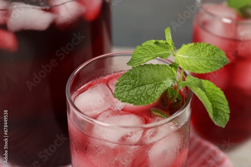 Wallpaper Mural Delicious iced hibiscus tea with mint against blurred background, closeup Torontodigital.ca