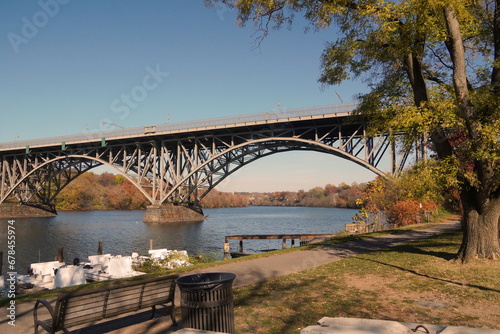 Arched Steel Bridge over Schuylkill River in Fall with Blue Sky © Monica