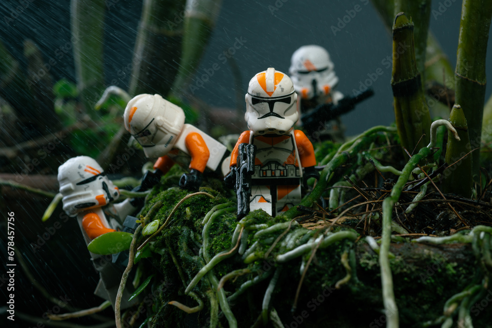 Obraz premium Depok, Indonesia - November 2, 2023: Lego toys photography, 212th clone troopers on swamp forest, bokeh background