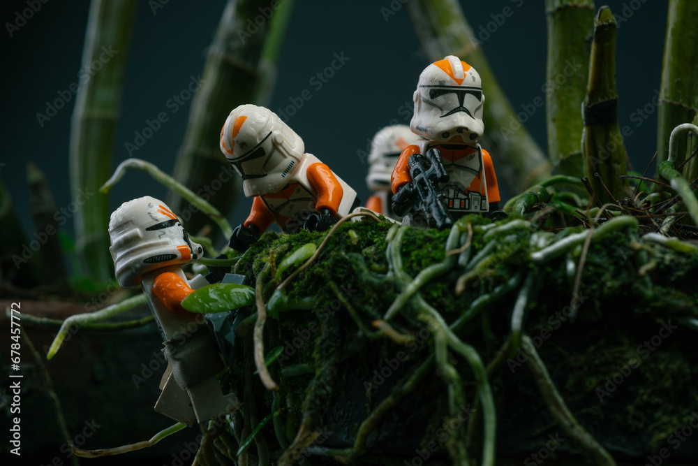 Naklejka premium Depok, Indonesia - November 2, 2023: Lego toys photography, 212th clone troopers on swamp forest, bokeh background