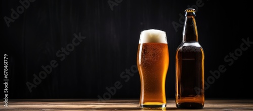 Two beer bottles one blonde and one amber resting horizontally