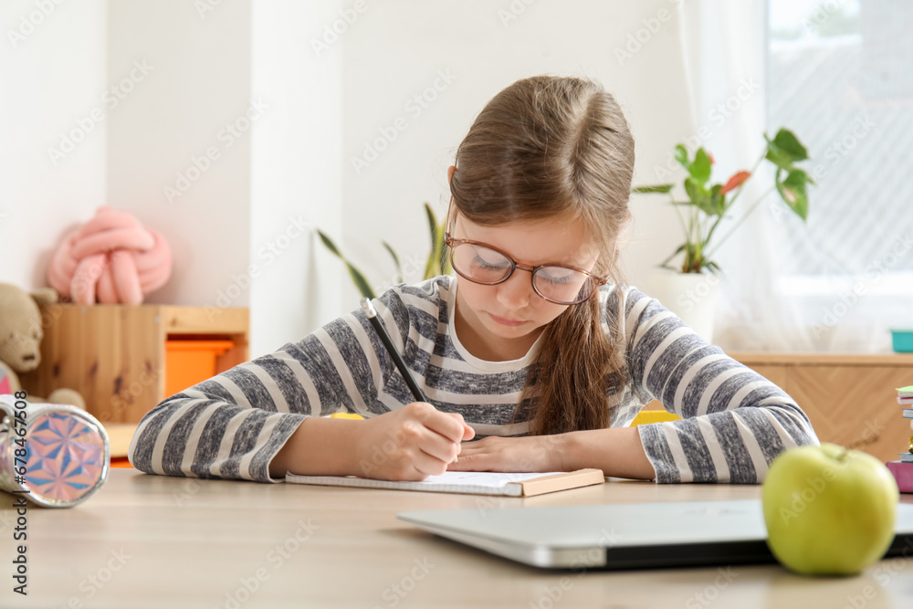 Little girl doing lessons at home Little girl doing lessons at home